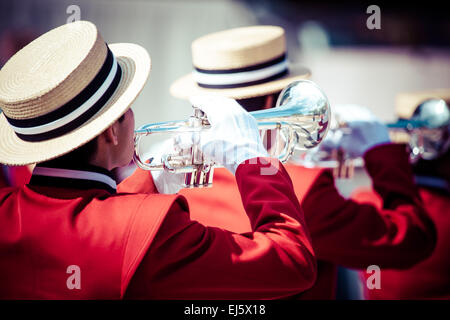 Brass Band in red uniform performing Stock Photo