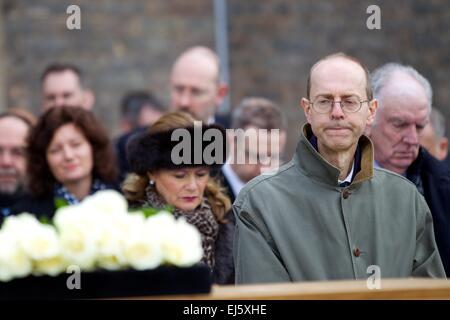 Leicester, UK. 22nd March, 2015. The departure of the mortal remains of King Richard III from the University of Leicester. Michael Ibsen, Richard III's nephew 16 times removed, looks on as the coffin is transferred to the hearse. Credit:  Michael Buddle/Alamy Live News Stock Photo