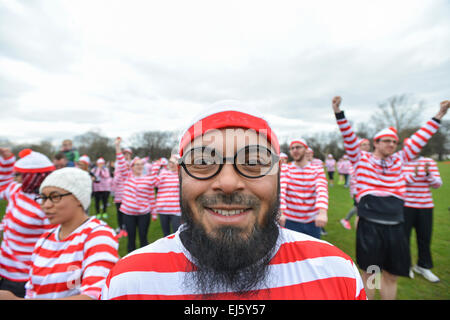 Victoria Park, London, UK. 22nd March 2015. Runners get ready for the race. The Where's Wally? Fun run for National Literacy Trust takes place in Victoria Park, London. With over 700 charity fun runners all wearing Where's Wally outfits Credit:  Matthew Chattle/Alamy Live News Stock Photo