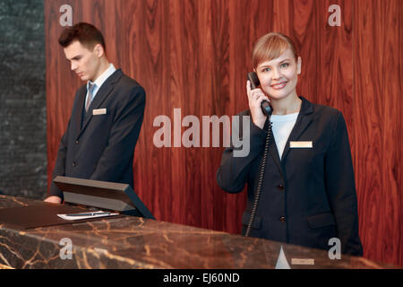 Receptionist answering the call Stock Photo