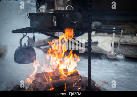 cooking on camping fire, Riisitunturi National Park, Finland, Lapland Stock Photo