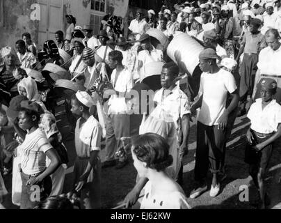 AJAXNETPHOTO. 1956. ST.GEORGES, GRENADA, WEST INDIES. -  CARNIVAL STEEL BANDS PARADING THE STREETS. PHOTO; REG CALVERT/AJAX  ©AJAX NEWS & FEATURE SERVICE/REG CALVERT COLLECTION    REF:1957 BW011 Stock Photo