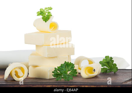 Curls of fresh butter on white background Stock Photo