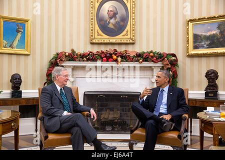 US President Barack Obama meets with Senate Minority Leader Mitch McConnell in the Oval Office of the White House December 3, 2014 in Washington, DC. Stock Photo