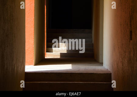 Concrete Corridor with Lights Coming In from the Side Stock Photo