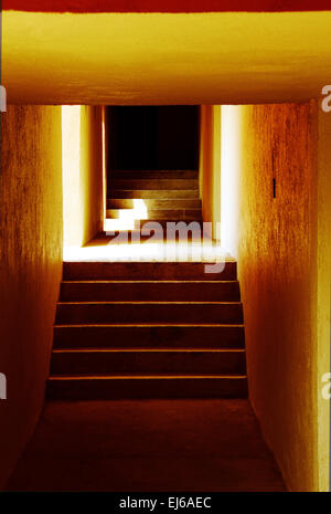 Concrete Corridor with Lights Coming In from the Side Stock Photo