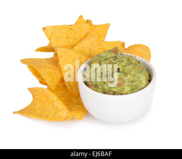 Green Guacamole with nachos and avocado on white background Stock Photo