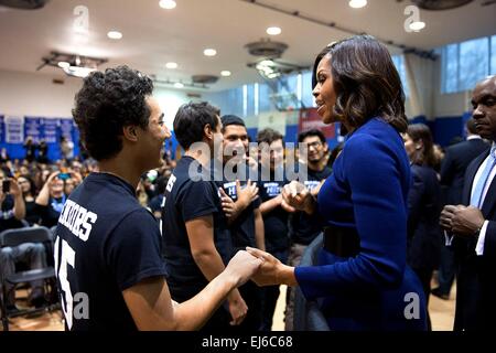 First Lady Michelle Obama talks with students  during a college application rally at the Capital City Public Charter School December 5, 2014 in Washington, D.C. Stock Photo