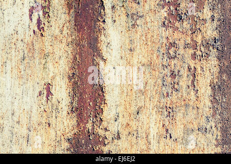 Old yellow grunge metal wall with red rust, background photo texture with vintage toned photo filter effect Stock Photo