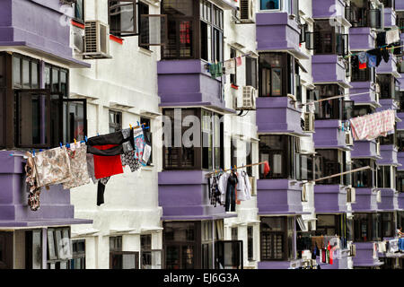 Laundry hanging on bamboo poles to dry in Chinatown in Singapore. Stock Photo