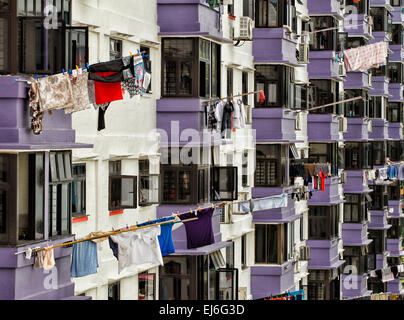 Laundry hanging on bamboo poles to dry in Chinatown in Singapore. Stock Photo