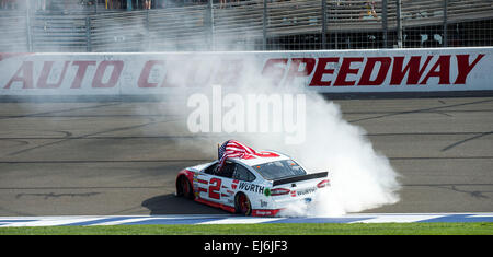 Fontana, CA, USA. 14th Mar, 2015. Fontana, CA - Mar 22, 2015: Brad Keselowski (2) celebrates his victory with a burnout down the front straight at the Auto Club 400 at Auto Club Speedway in Fontana, CA. © csm/Alamy Live News Stock Photo