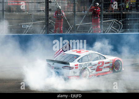 Fontana, CA, USA. 14th Mar, 2015. Fontana, CA - Mar 22, 2015: Brad Keselowski (2) celebrates his victory with a burnout down the front straight at the Auto Club 400 at Auto Club Speedway in Fontana, CA. © csm/Alamy Live News Stock Photo