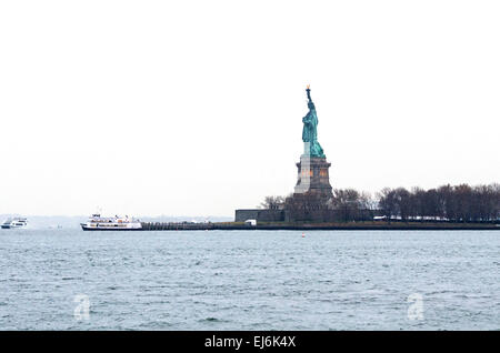 View of the Statue of Liberty and Liberty Island from the ferry boat, New York. Stock Photo