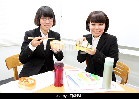 Young Japanese business people having lunch together Stock Photo