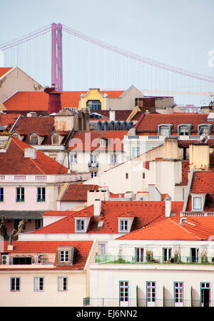 Lisbon rooftops with Ponte 25 de Abril suspension bridge Stock Photo