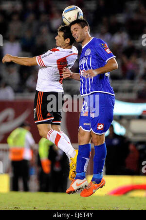 Buenos Aires, Argentina. 22nd Mar, 2015. River Plate's Rodrigo Mora (L) vies the ball with Godoy Cruz's Leonel Galeano during the match corresponding to the first division championship of the Argentine soccer, in the Monumental Stadium, in Buenos Aires, Argentina, on March 22, 2015. River Plate won the match. © Alejandro Santa Cruz/TELAM/Xinhua/Alamy Live News Stock Photo