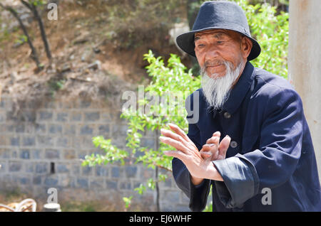 Old Chinese Man Provides Shaolin Kung Fu Demonstration in Luo Yang, China. Stock Photo