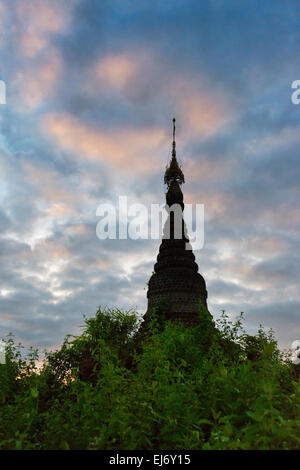 Ancient temple and pagoda in the jungle at sunrise, Mrauk-U, Rakhine State, Myanmar Stock Photo