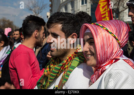 Kurdish, Turkey. 22nd Mar, 2015. A couple watch men jumping over the fire at the Newroz celebration rally. © Piero Castellano/Pacific Press/Alamy Live News Stock Photo