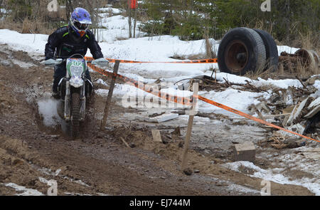 A enduro motorcycle rider driving in the famous Lake Päijänne Enduro race in Finland. Stock Photo