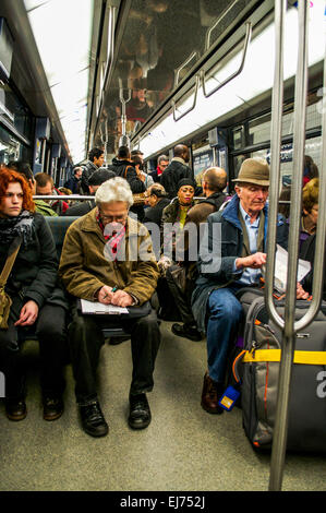 A full train car in the Paris Metro during rush hour. Stock Photo