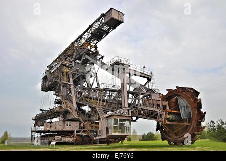 Coal digger is in a disused mining Stock Photo