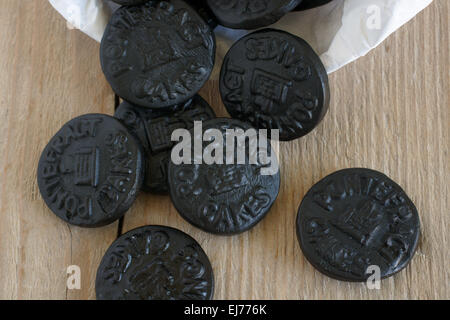 Pontefract Cakes a licorice sweet from Yorkshire stamped with the castle lodge emblem a traditional design dated to 1612 Stock Photo