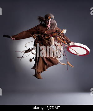 Studio shot of angry shaman posing in jump Stock Photo