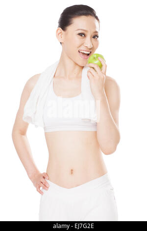 The young woman to eat apples Stock Photo