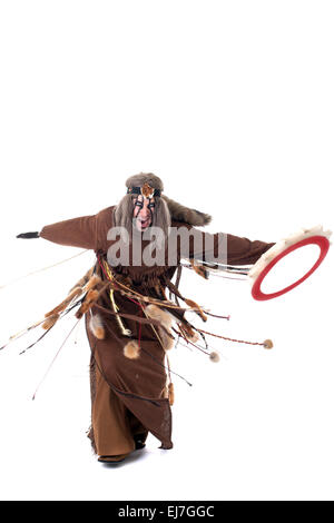 Shot of angry shaman dancing with tambourine Stock Photo