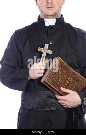 Piest holding a cross and bibles Stock Photo