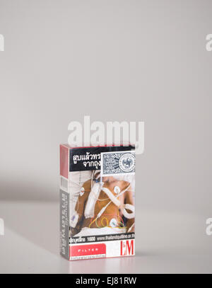 A deterring image of a patient connected to medical mashines features  on a package of cigarettes of the brand L&M from Thailand in Berlin, Germany,  6 March 2015. Photo:  Lukas Schulze/dpa Stock Photo