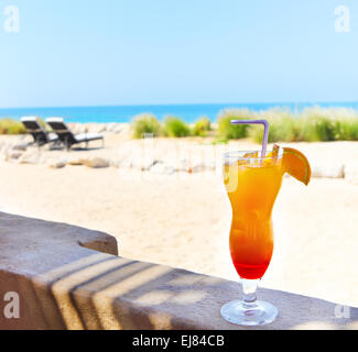 Orange cocktail on the beach Stock Photo