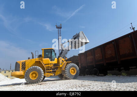 Loader loads the wagon train Stock Photo