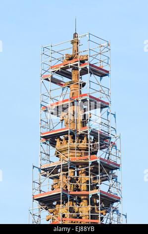 Church tower surrounded by scaffolding Stock Photo