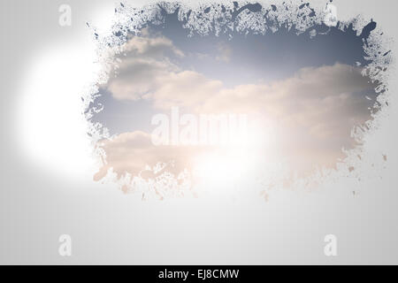 Splash on wall revealing bright sky Stock Photo