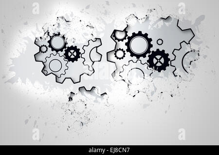Splash on wall revealing cogs and wheels Stock Photo
