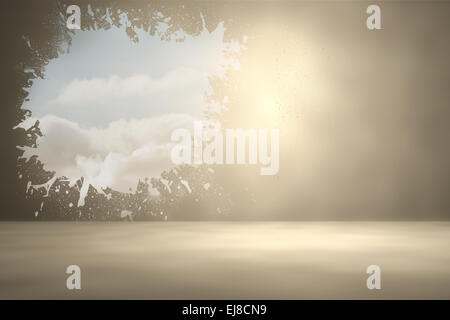 Splash on wall revealing bright sky Stock Photo