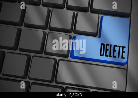 Delete on black keyboard with blue key Stock Photo