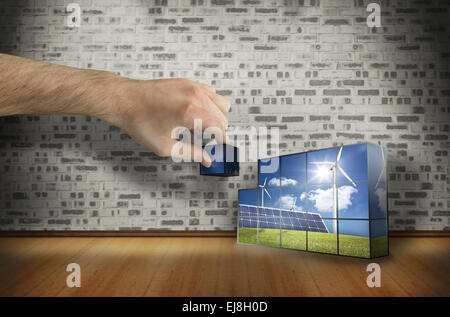 Composite image of hand building wall Stock Photo