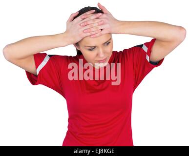 Disappointed football fan in red Stock Photo