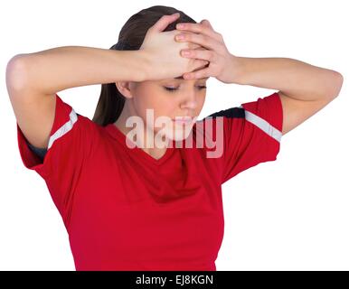 Disappointed football fan in red Stock Photo