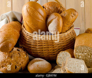 Different types of bread on  wooden table Stock Photo