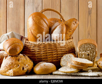 Different types of bread on  wooden background Stock Photo