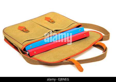 Traditional retro khaki canvas and leather briefcase containing red and blue folders isolated on a white background. Education business concept. UK Stock Photo