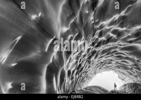 man inside a glacier, Kebnekaise mountains, Sweden Stock Photo