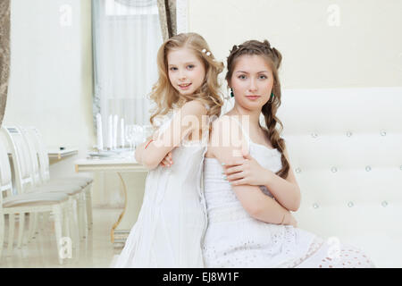 Lovely young models posing in restaurant Stock Photo