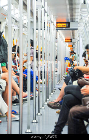 a lot of passengers in the subway car Stock Photo