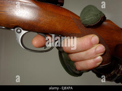 Close up of an index finger on the trigger. Stock Photo